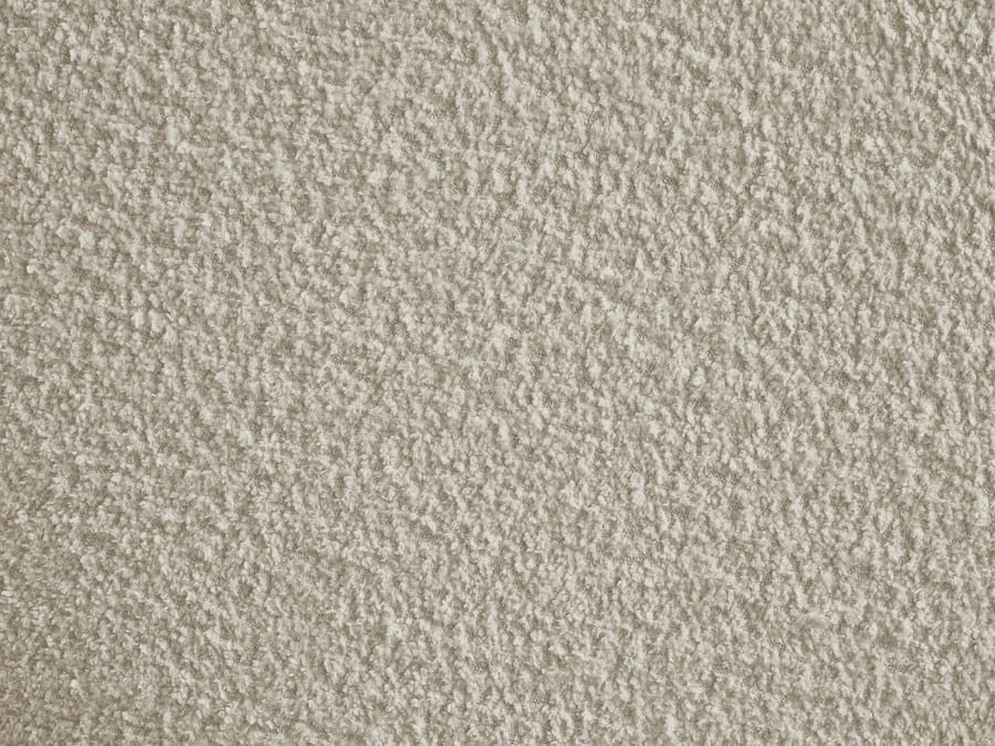 Gros plan de la texture et matière du tissu beige du canapé Tina.